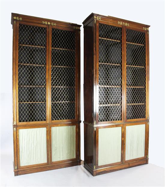 A suite of five Regency rosewood and brass mounted library bookcase cabinets, overall W.25ft 4in. approx.